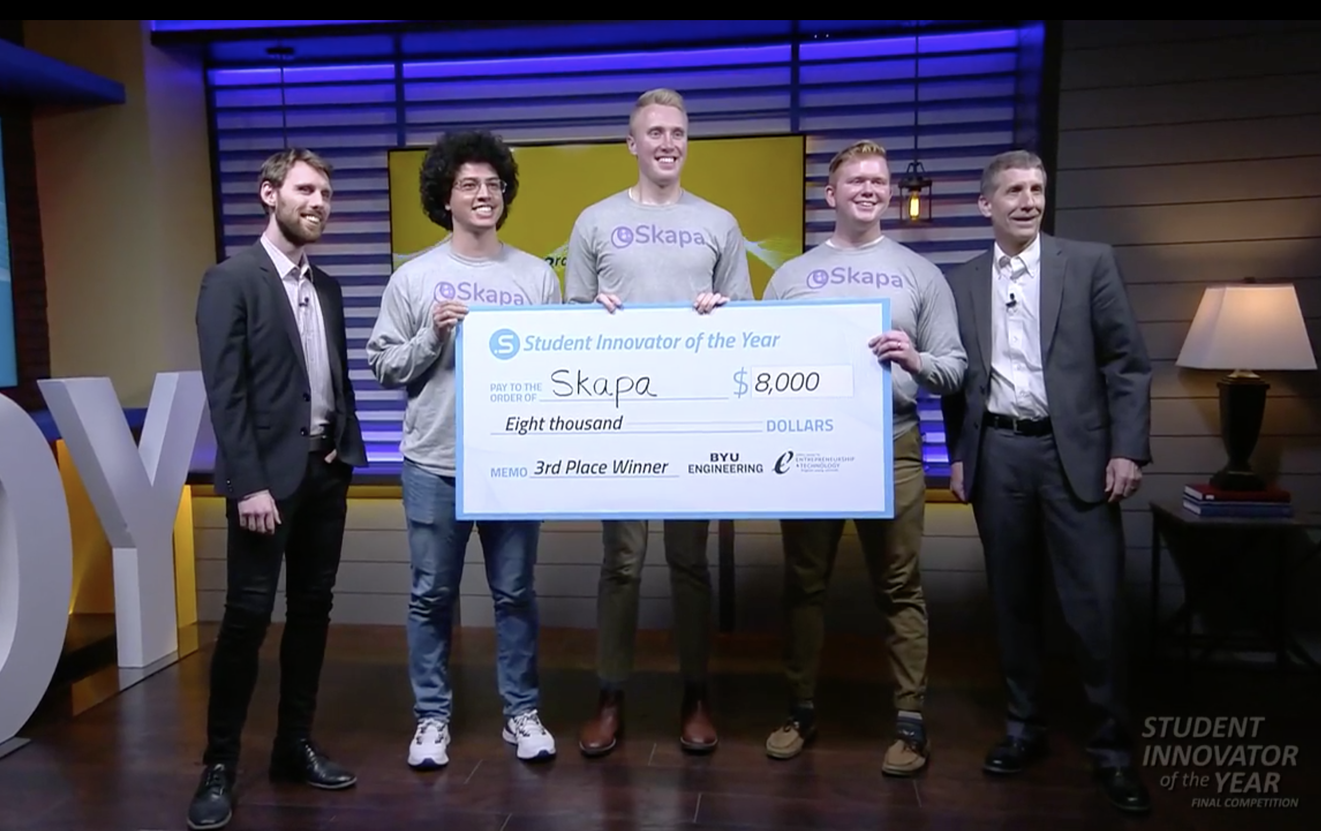 Picture of me, Jacob, and Spencer holding a large check